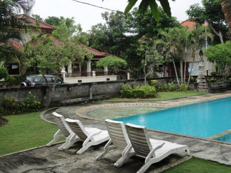 One of the pools with the house in the back Bali Real Estate