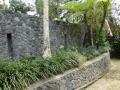 Inca like stone carved wall, Glass Pyramid Pavillion, Design villa