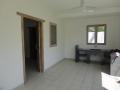 Sharply priced new Sanur villa Living area with open kitchen in the back