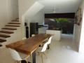 Attractive modern Canggu villa Dining area with open kitchen in the back